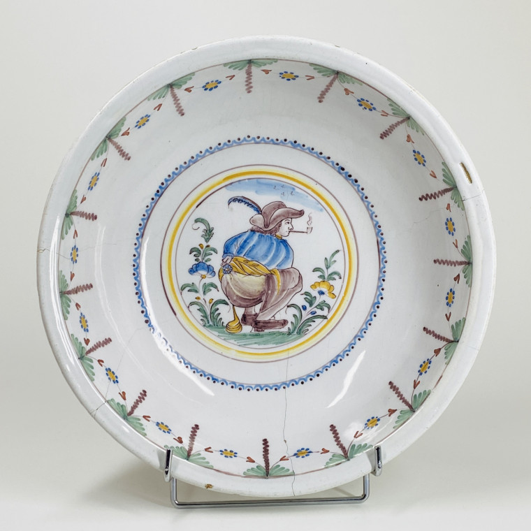 Large earthenware bowl from Roanne with saucy decoration - Eighteenth century