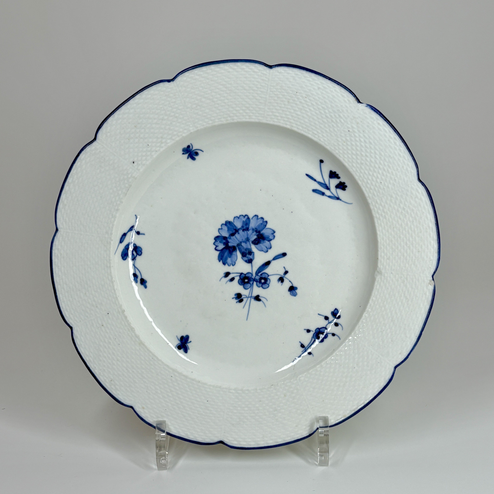 Three Chantilly porcelain plates with a carnation - Eighteenth century