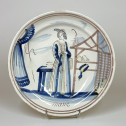 Desvres earthenware dish decorated with a woman shopping - Eighteenth century