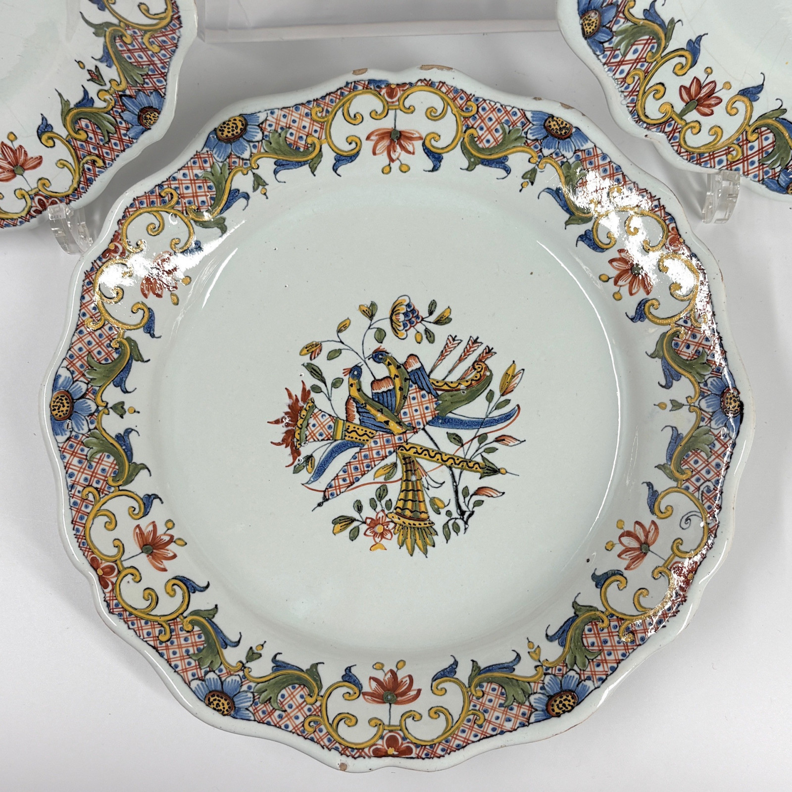 Four Rouen earthenware plates "with quiver" - Eighteenth century