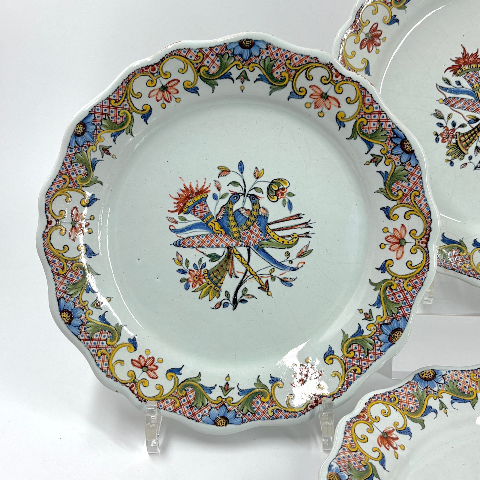 Four Rouen earthenware plates "with quiver" - Eighteenth century