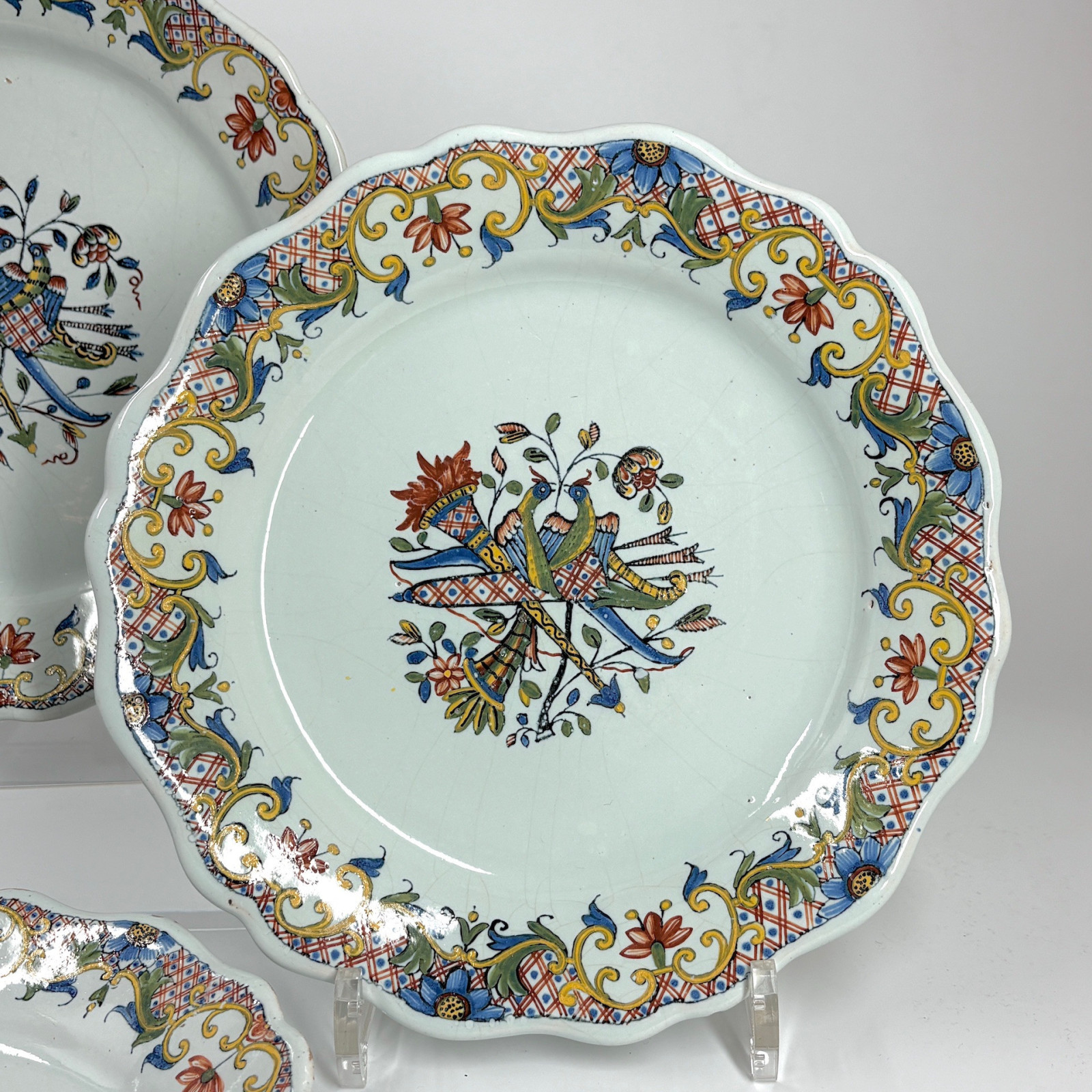 Four Rouen earthenware plates "with quiver" - Eighteenth century
