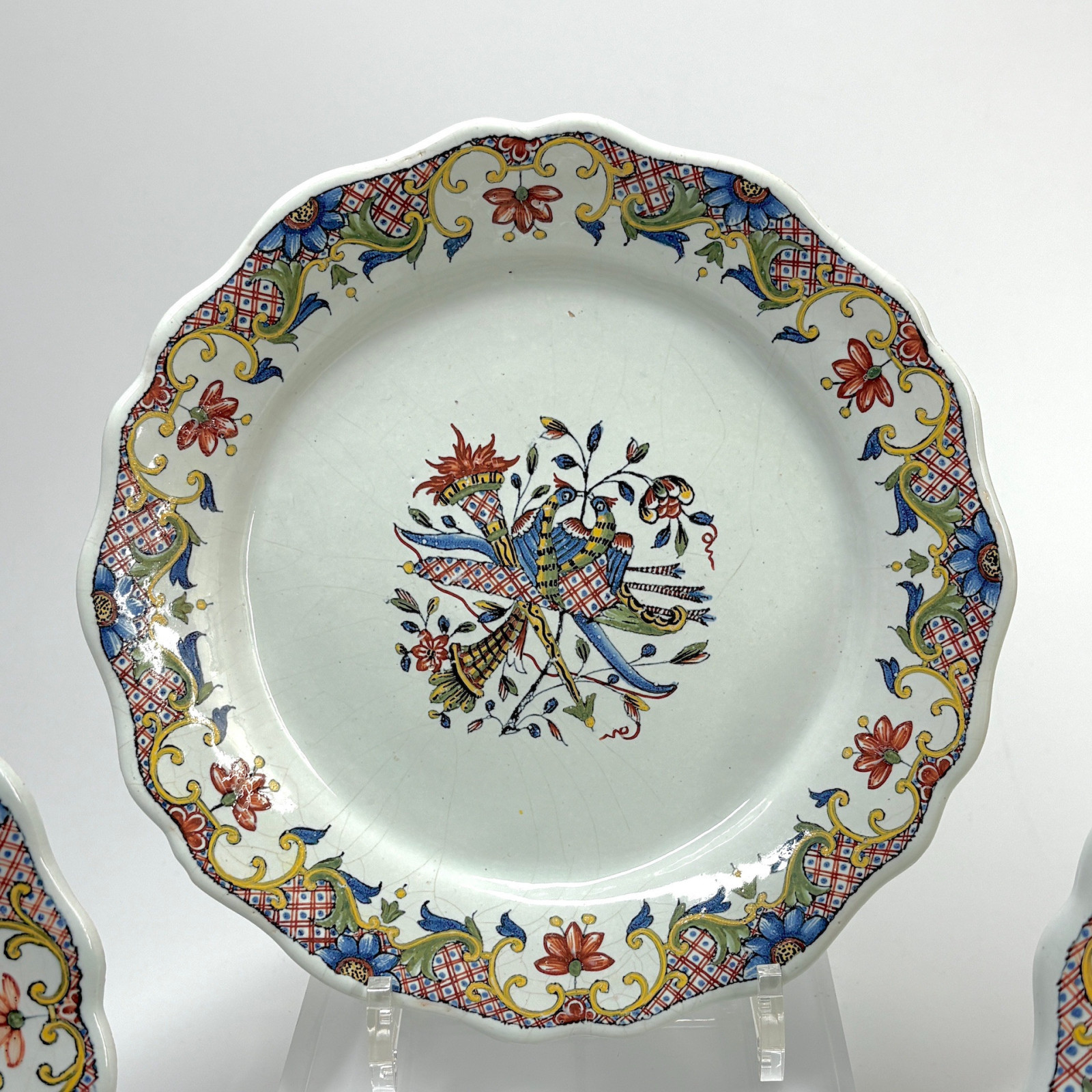 Four Rouen earthenware plates "with quiver" - Eighteenth century