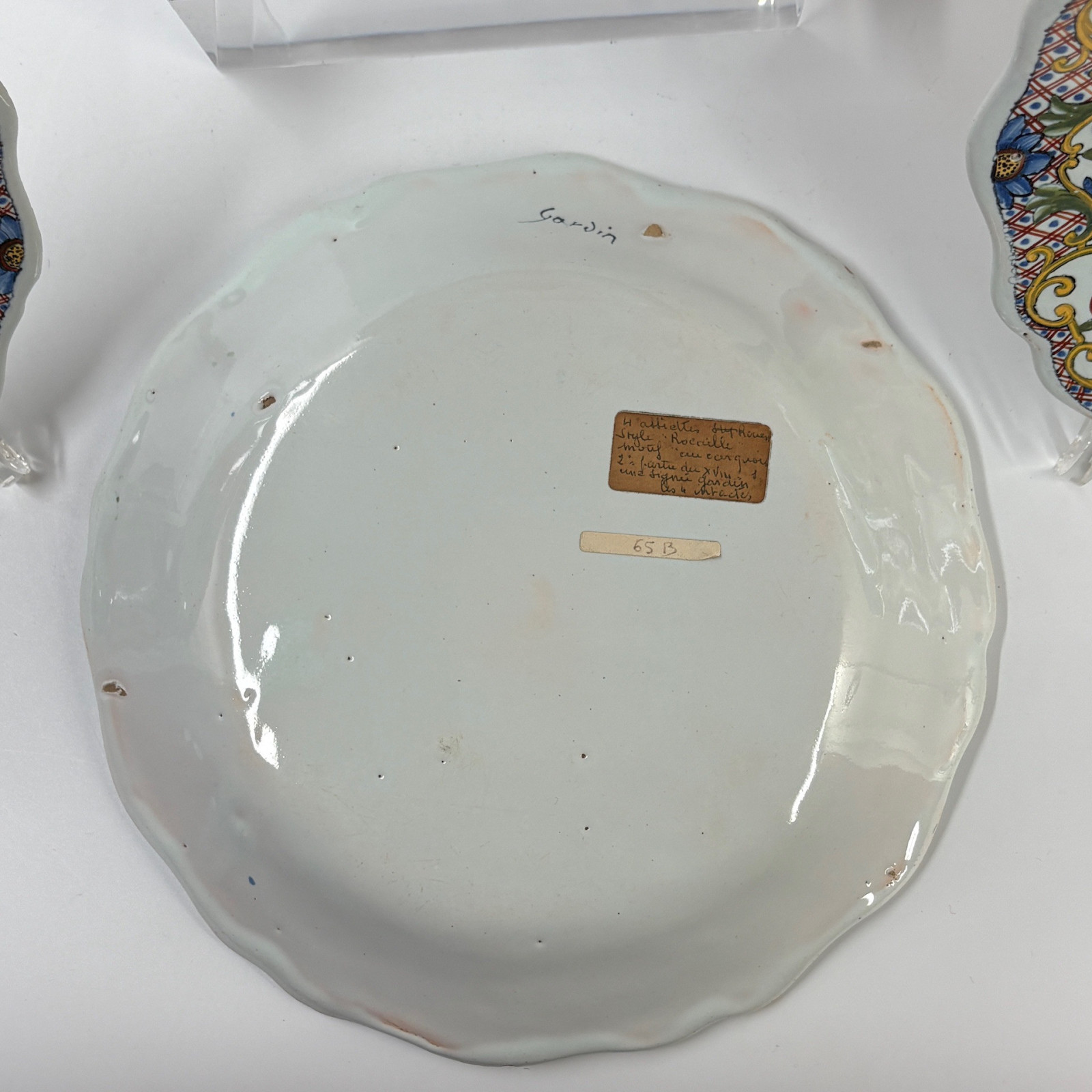 Four Rouen earthenware plates "with quiver" - Eighteenth century