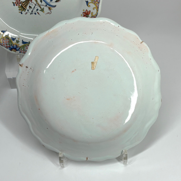 Four Rouen earthenware plates "with quiver" - Eighteenth century