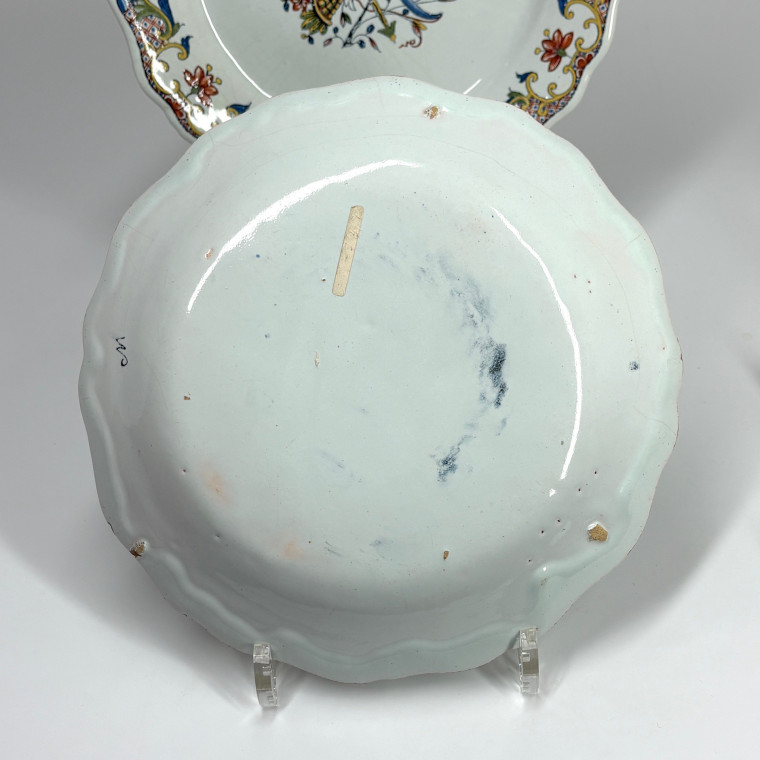 Four Rouen earthenware plates "with quiver" - Eighteenth century