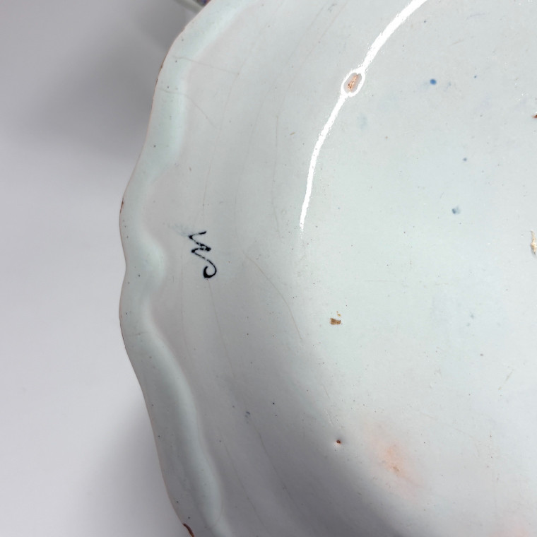 Four Rouen earthenware plates "with quiver" - Eighteenth century