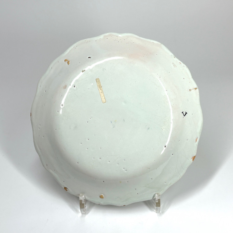 Four Rouen earthenware plates "with quiver" - Eighteenth century