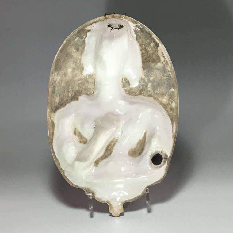 Nevers earthenware of the seventeenth century - plate forming an arm holding a candle