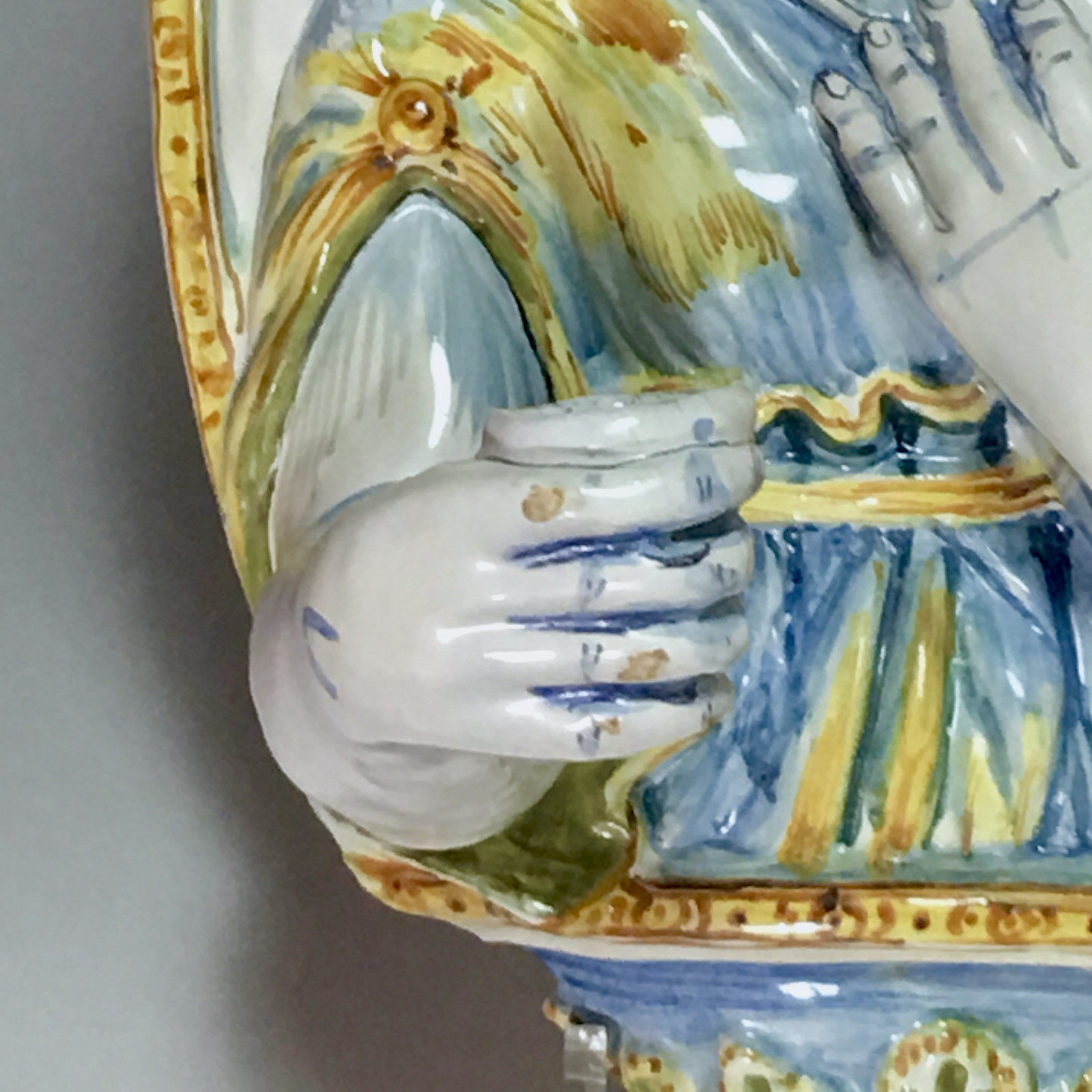 Nevers earthenware of the seventeenth century - plate forming an arm holding a candle