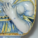 Nevers earthenware of the seventeenth century - plate forming an arm holding a candle