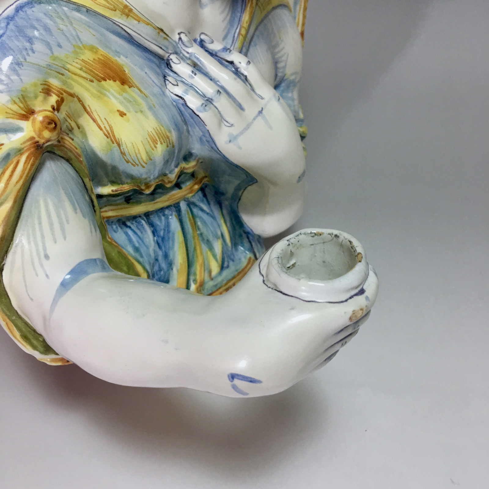 Nevers earthenware of the seventeenth century - plate forming an arm holding a candle