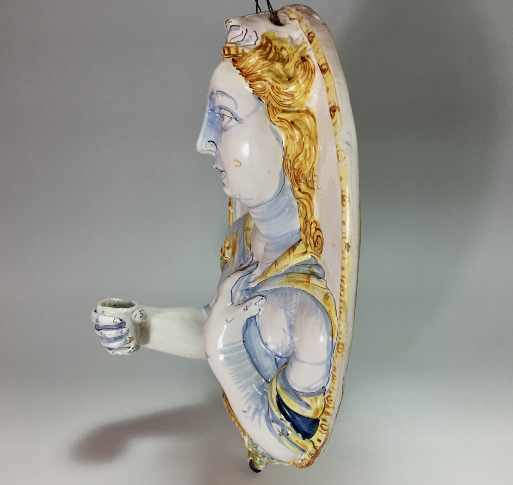 Nevers earthenware of the seventeenth century - plate forming an arm holding a candle