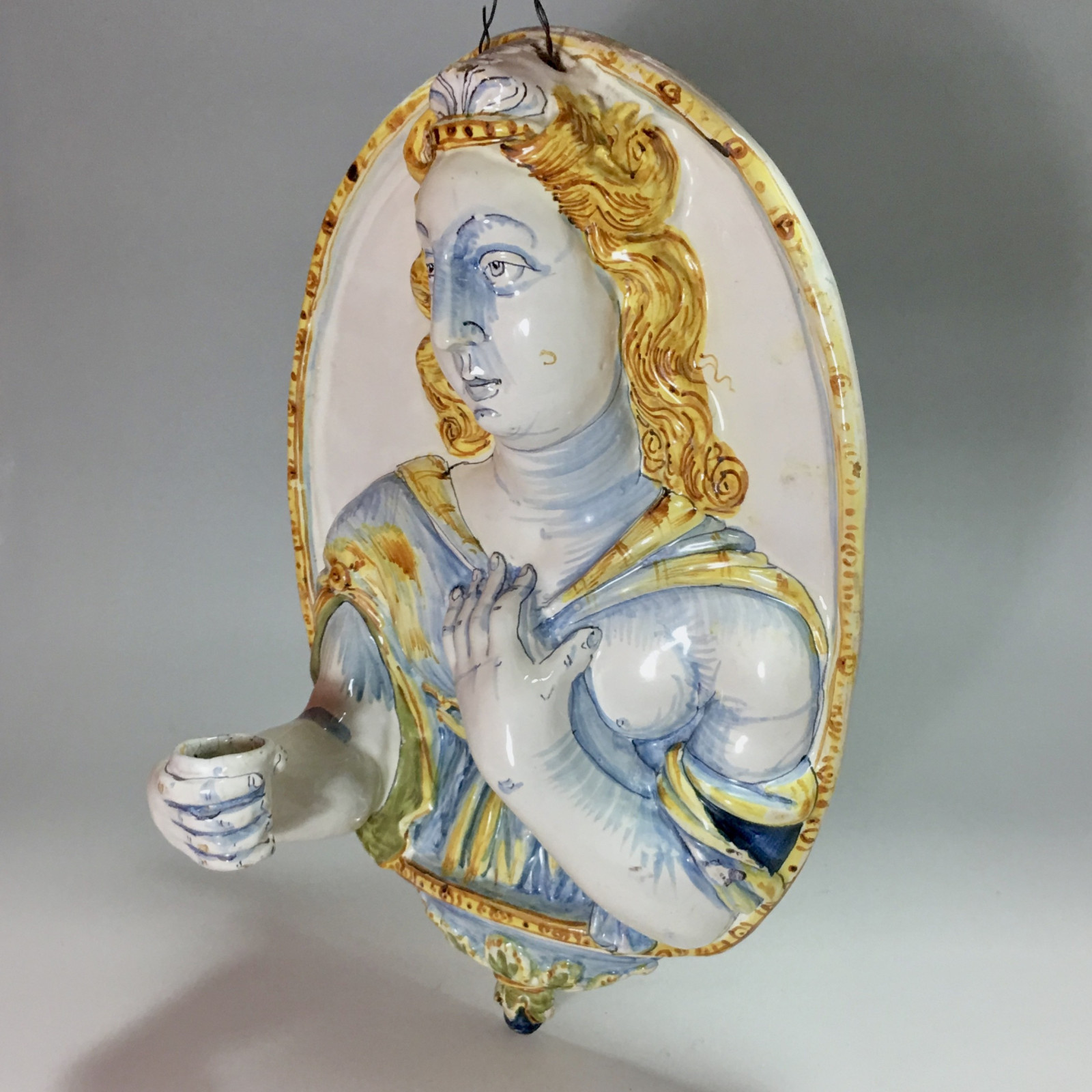 Nevers earthenware of the seventeenth century - plate forming an arm holding a candle