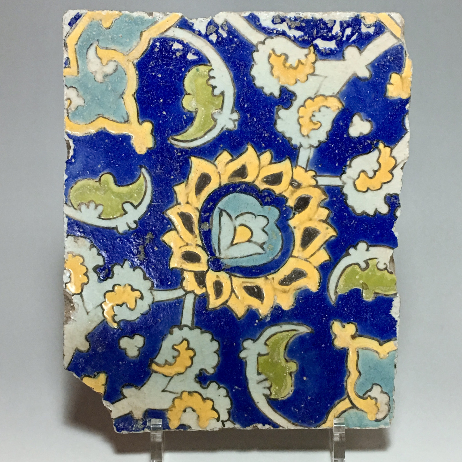 Two polychrome floral decoration tiles in style "cuerda seca" - Iran - Safavid Art - Seventeenth century.