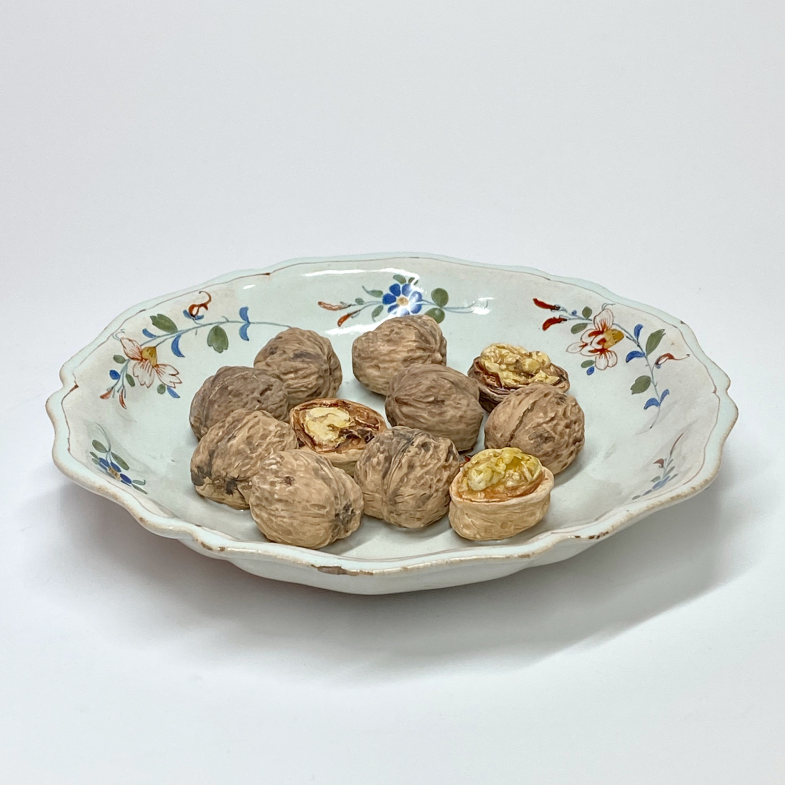 Rouen or Sinceny - Deep plate decorated with trompe l'oeil nuts - Eighteenth century