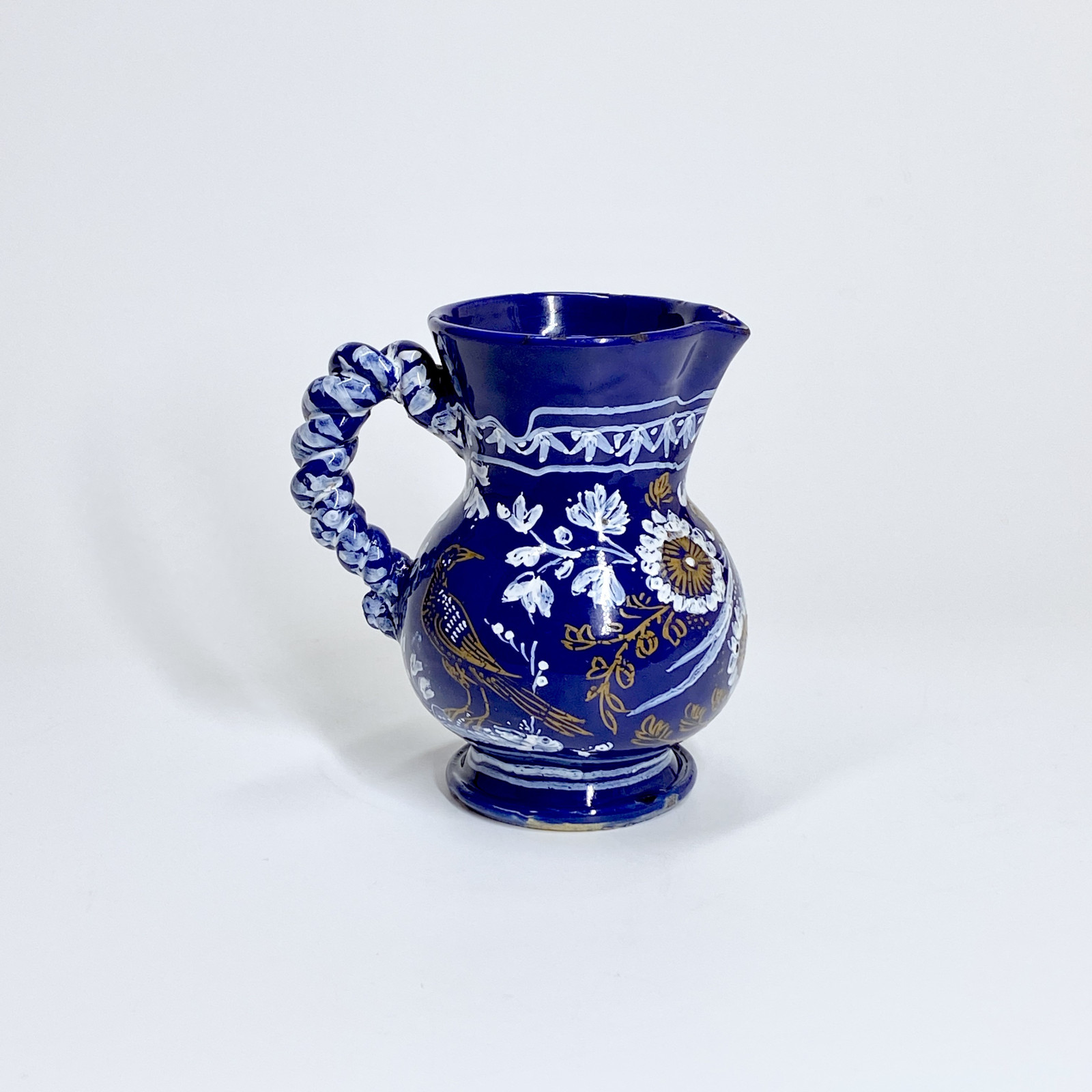 Nevers. Small earthenware pitcher with Persian blue background - Seventeenth century - Circa 1650