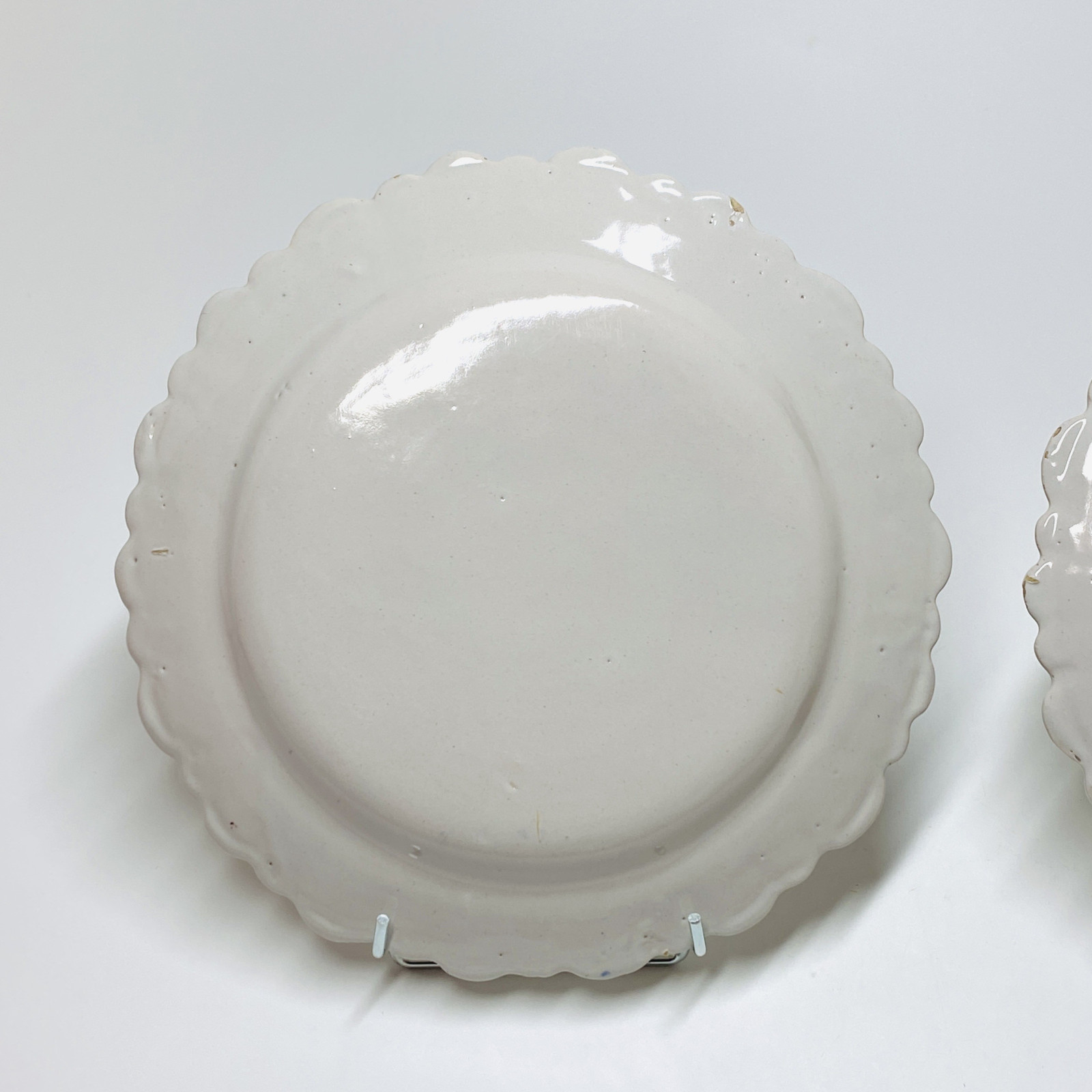 Pair of earthenware plates from Roanne - Eighteenth century