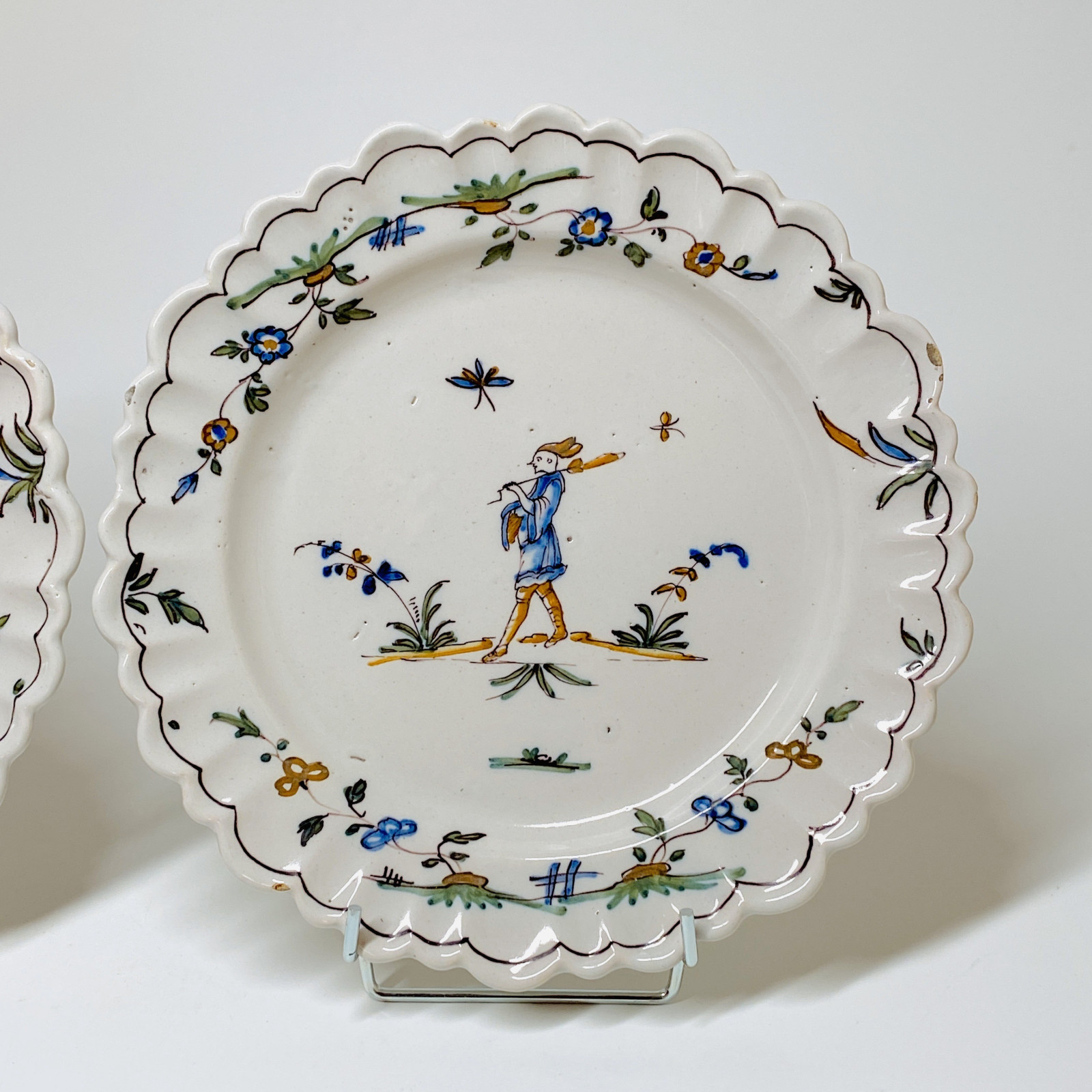 Pair of earthenware plates from Roanne - Eighteenth century